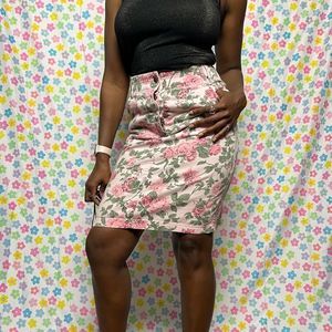 Really cute high waist pink floral skirt.  Slit in the back with pockets! Size 4